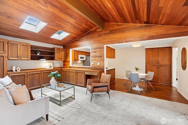 living room featuring lofted ceiling with skylight, wood ceiling, and wood finished floors