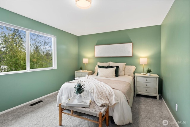 bedroom featuring carpet, visible vents, and baseboards