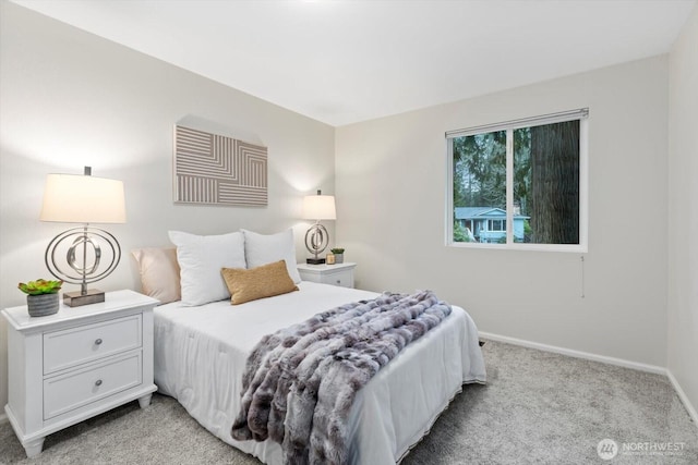 bedroom with carpet and baseboards