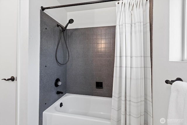 bathroom with shower / bathtub combination with curtain