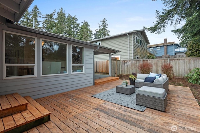 deck with fence and an outdoor living space