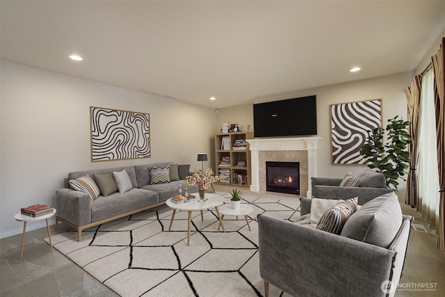 living area with visible vents, baseboards, recessed lighting, a tiled fireplace, and light colored carpet