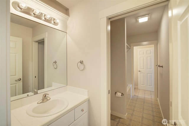 bathroom with vanity, tile patterned floors, shower / tub combination, and baseboards