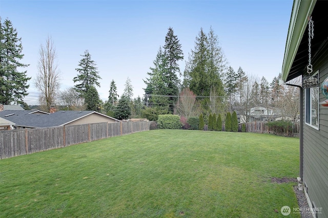 view of yard with a fenced backyard