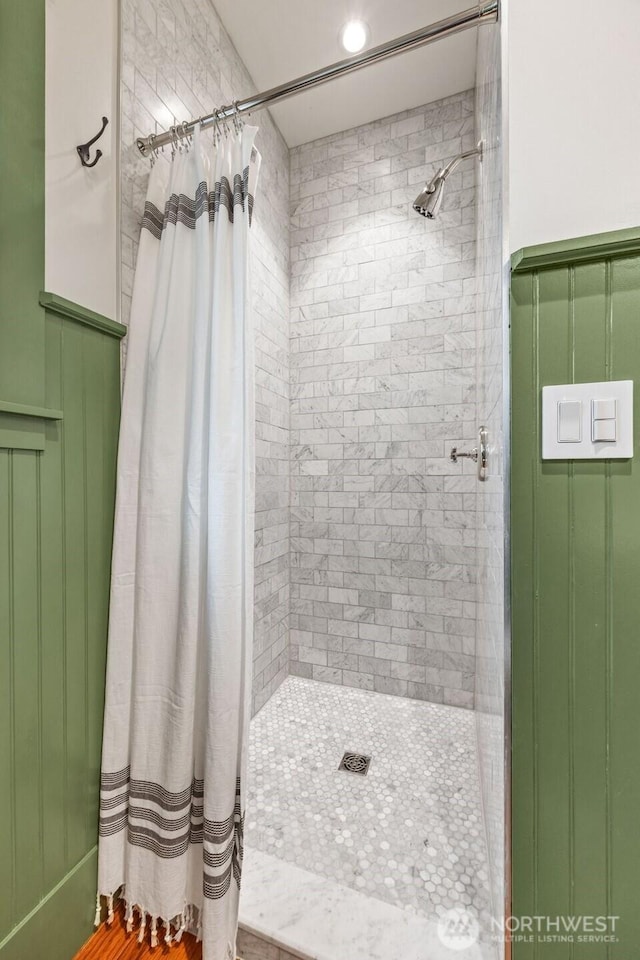 full bathroom with tiled shower