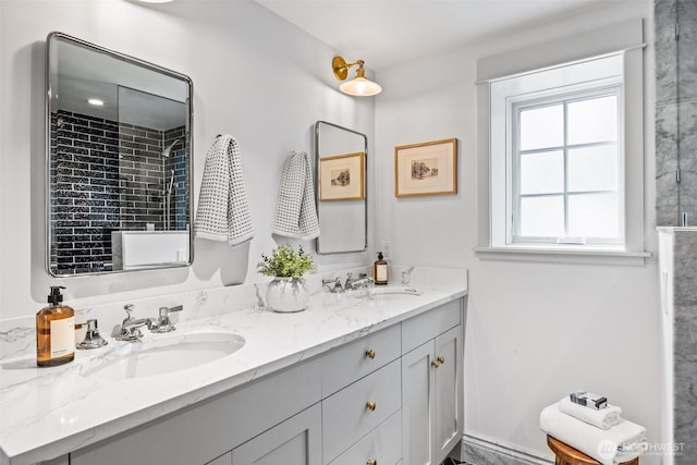 full bath featuring double vanity and a sink