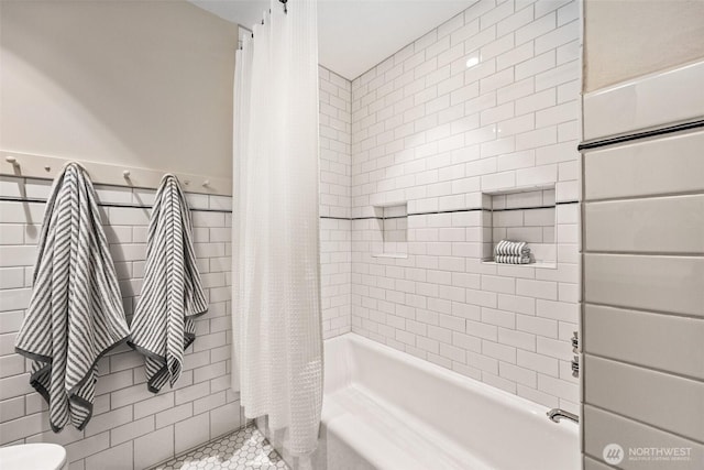 bathroom with toilet, tile patterned flooring, and shower / bath combination with curtain