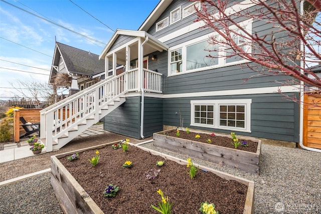 view of property exterior featuring a vegetable garden