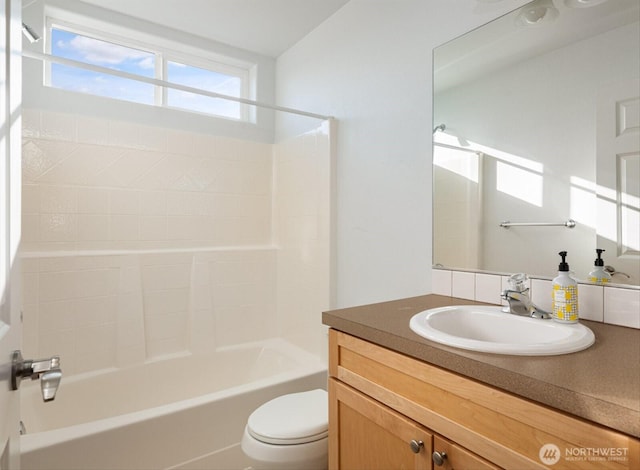 full bath with tub / shower combination, vanity, and toilet