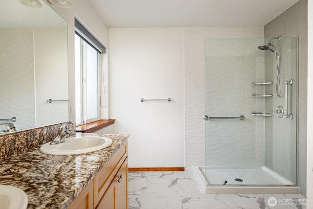 bathroom with a wealth of natural light, a stall shower, and marble finish floor