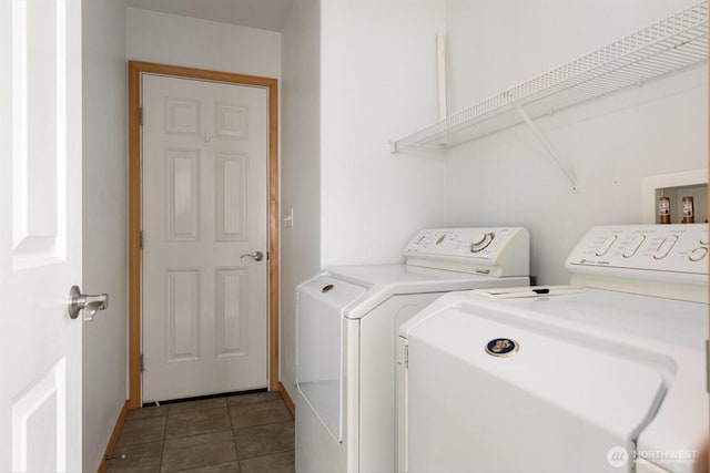 washroom with laundry area, separate washer and dryer, and tile patterned floors