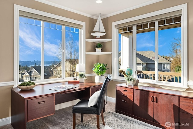 home office with baseboards and crown molding