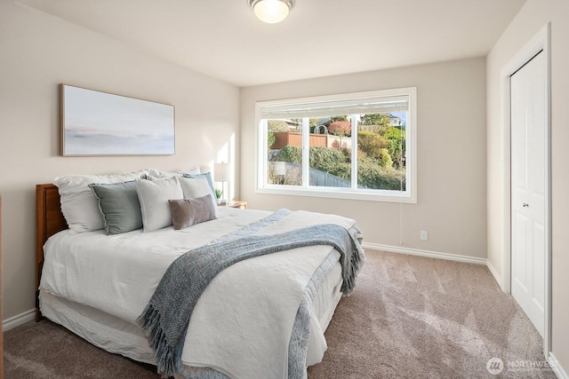 carpeted bedroom with baseboards