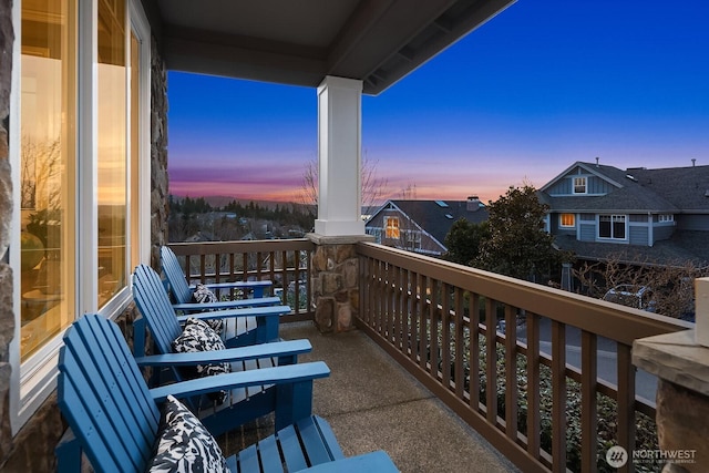 view of balcony at dusk