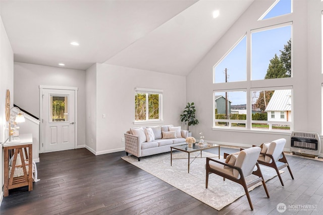 living room with baseboards, recessed lighting, dark wood finished floors, and heating unit