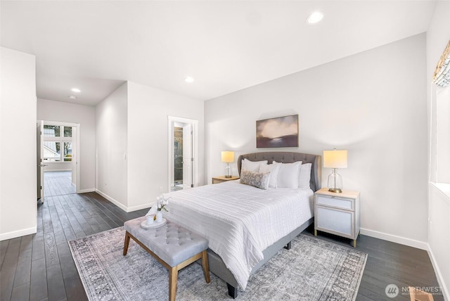 bedroom with recessed lighting, dark wood finished floors, and baseboards