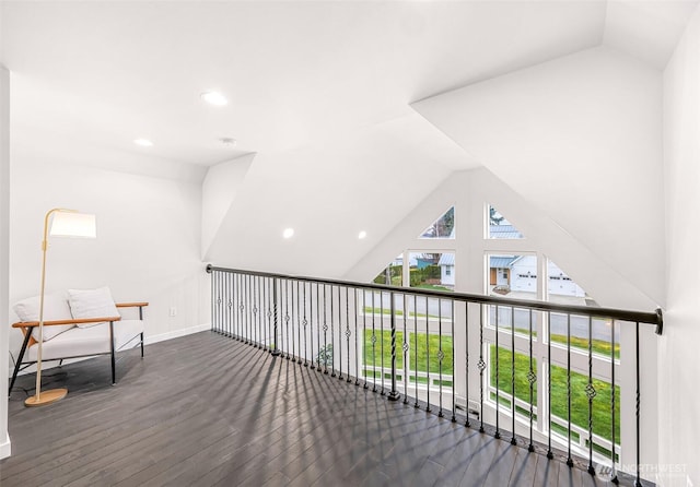 bonus room featuring lofted ceiling, baseboards, wood finished floors, and recessed lighting