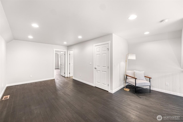 interior space with baseboards, dark wood-type flooring, visible vents, and recessed lighting