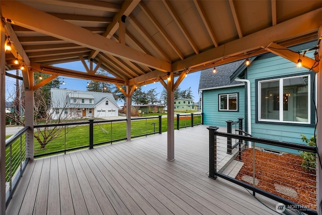 deck featuring a residential view, a lawn, and a gazebo