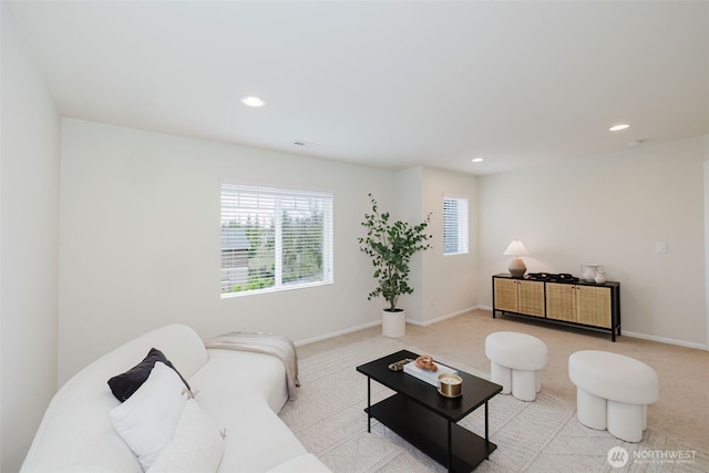 living area with recessed lighting, carpet flooring, and baseboards