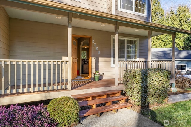 doorway to property featuring covered porch