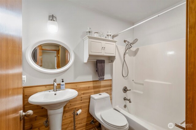 bathroom with toilet and shower / bathtub combination