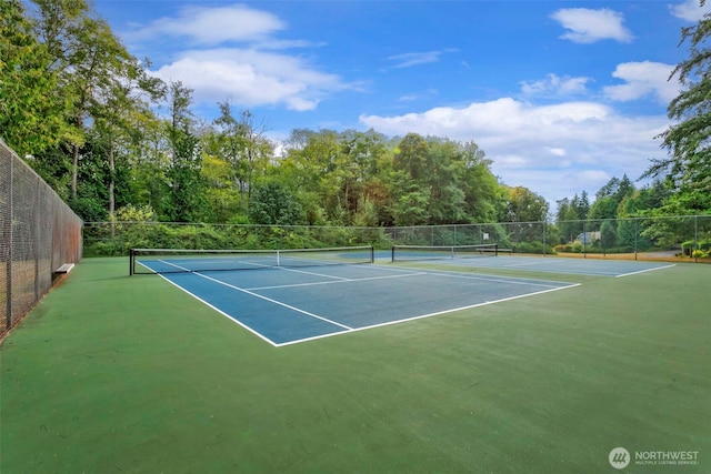 view of sport court with fence