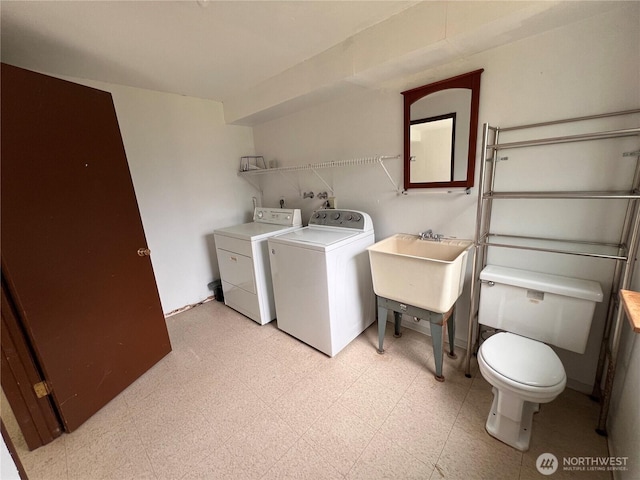 2109 Ontario St, Bellingham, WA 98229 - laundry room featuring light floors, laundry area, separate washer and dryer, and a sink