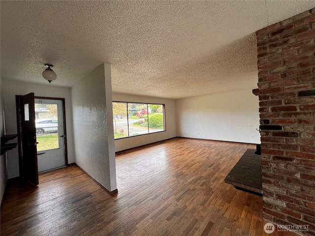2109 Ontario St, Bellingham, WA 98229 - entrance foyer featuring a textured ceiling, plenty of natural light, wood finished floors, and baseboards