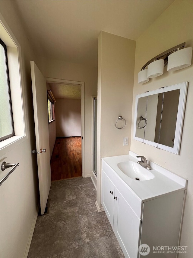 2109 Ontario St, Bellingham, WA 98229 - full bath featuring a shower with door, baseboards, and vanity