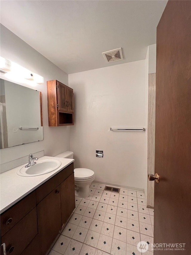 2109 Ontario St, Bellingham, WA 98229 - bathroom with vanity, toilet, visible vents, and tile patterned floors