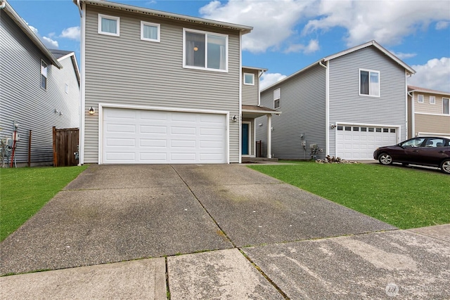 traditional home featuring a garage, concrete driveway, and a front yard