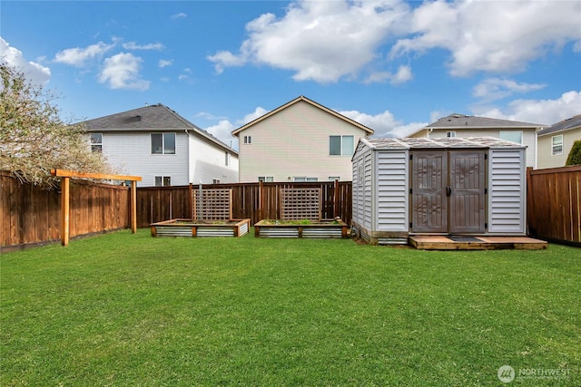 rear view of property featuring a storage unit, a lawn, a fenced backyard, a vegetable garden, and an outdoor structure