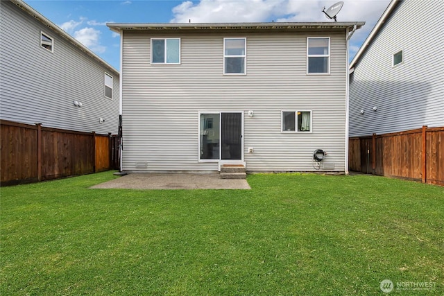 rear view of property with a yard, a patio, and a fenced backyard