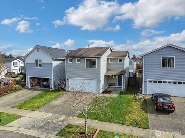 traditional-style home with a residential view, concrete driveway, and a front lawn