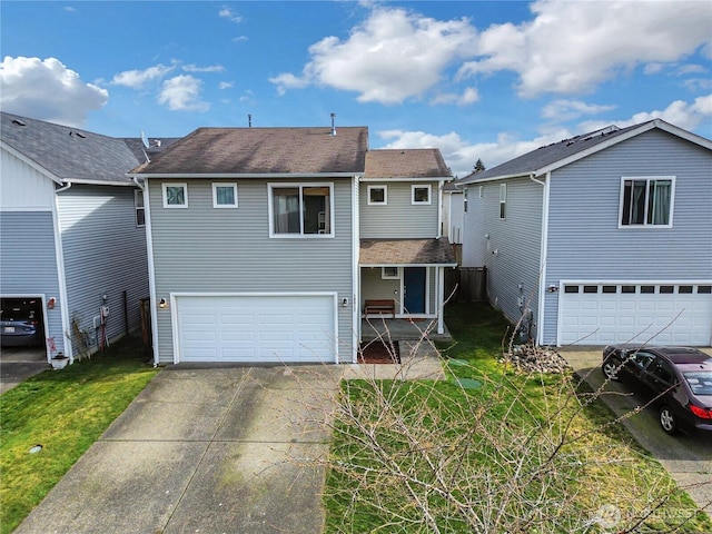 exterior space with an attached garage, a yard, and driveway