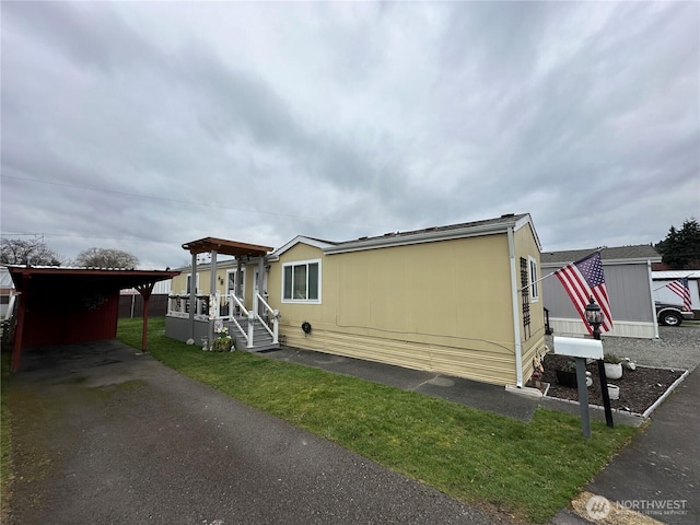 view of side of home featuring a carport