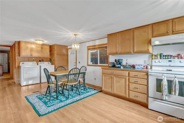 kitchen featuring pendant lighting, light wood-style flooring, electric range, washer and dryer, and under cabinet range hood