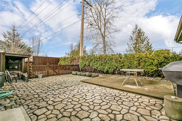 view of patio featuring fence