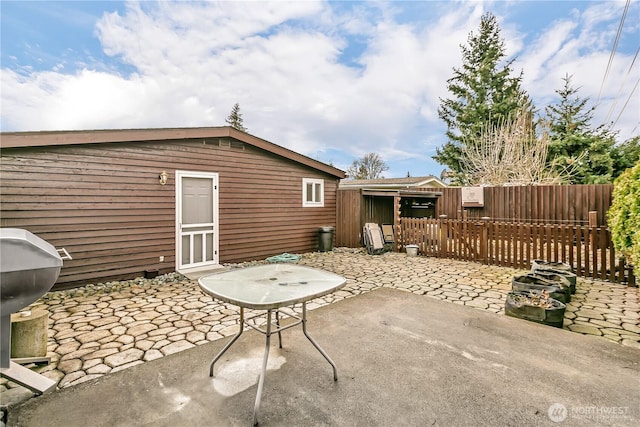 view of patio with fence and grilling area