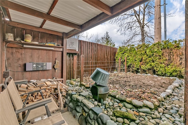 view of patio / terrace featuring fence