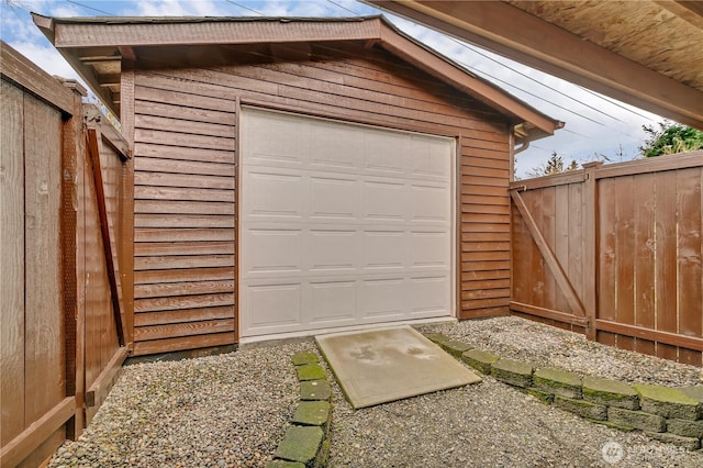 garage featuring fence