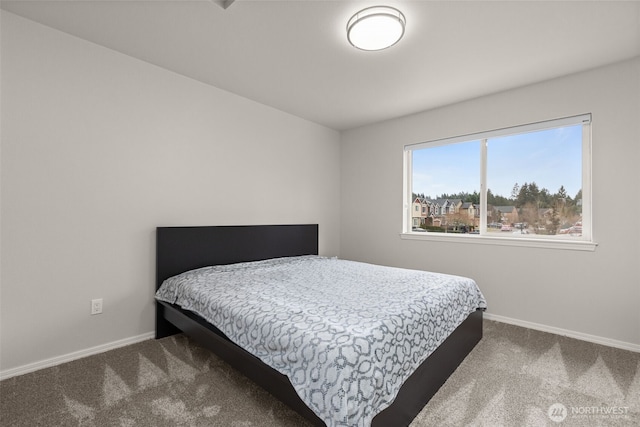 carpeted bedroom with baseboards