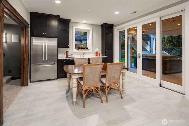dining room featuring french doors and recessed lighting