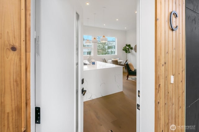 bathroom featuring wood finished floors and recessed lighting