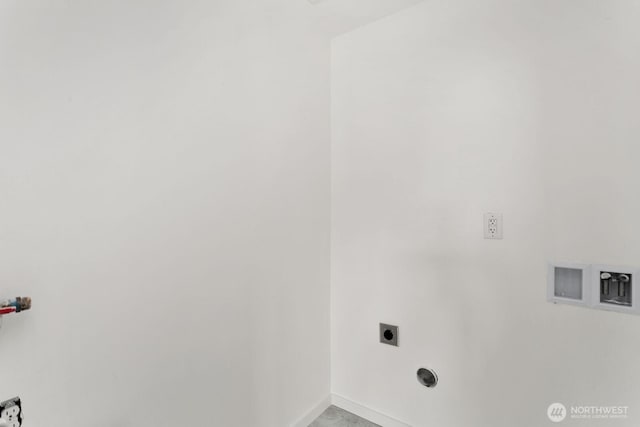 laundry area featuring baseboards, laundry area, and hookup for an electric dryer