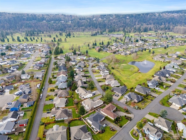 birds eye view of property featuring a water view and a residential view