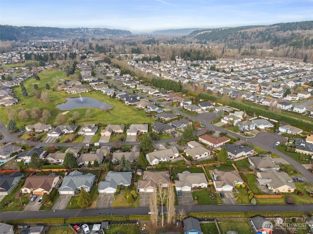 birds eye view of property featuring a water view and a residential view