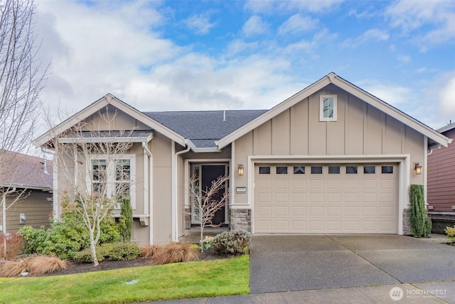 ranch-style home with a garage, driveway, a shingled roof, stone siding, and board and batten siding