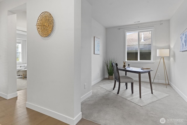 office with baseboards and a healthy amount of sunlight